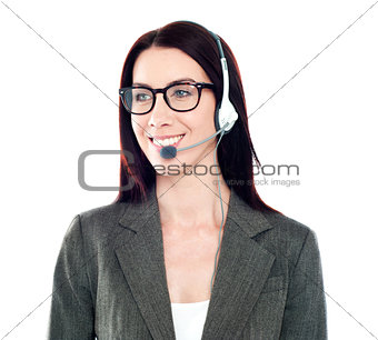 Cheerful female customer care operator looking away