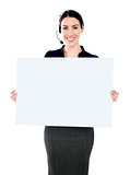 Call centre executive standing with a blank billboard