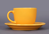 orange cup and saucer