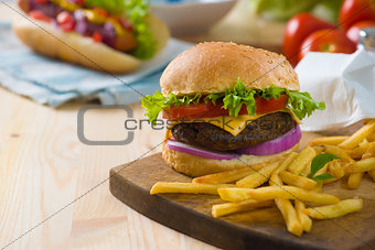 burger with fast food items and materials on the background