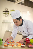 asian chinese chef preparing foods for his customer with kitchen