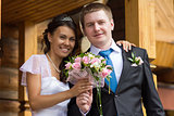 The bride and groom with a bouquet 