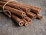 cinnamon sticks on old wooden table