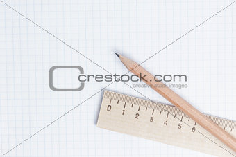 pencils and ruler on notebook page
