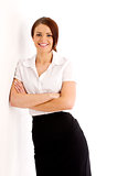 Business woman leaning against a wall