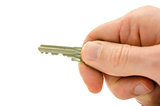 Detail of hand holding a house key