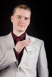 attractive man with banknotes in his pocket