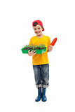 Young boy with seedlings ready for gardening