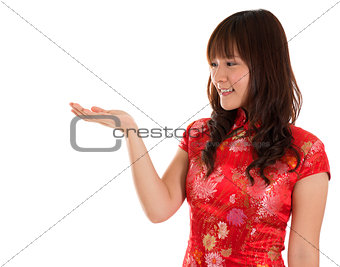 Chinese Cheongsam woman showing something