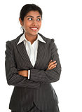 Indian businesswoman hands folded looking side.