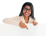 Indian woman holding and pointing to blank billboard.