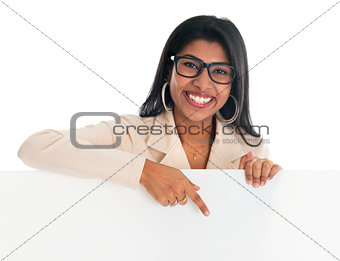 Indian woman holding and pointing to blank billboard.