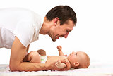 Caucasian father playing with baby son