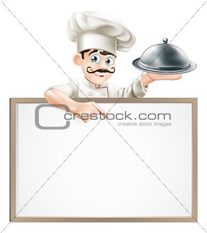 Chef pointing at sign