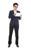 asian business male using tablet on isolated white background, f