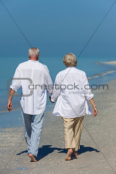 Happy Senior Couple Walking Holding Hands Tropical Beach
