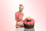 blonde woman with cupcakes