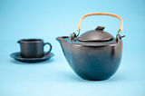 retro black tea pot cup saucer composition blue 
