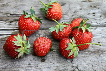 Fresh strawberries on old wooden background