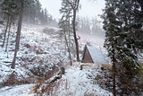 wooden hut in winter mountains