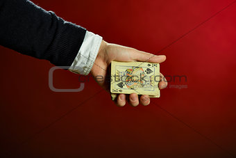 Hand holding playing cards