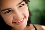 Cheerful young hispanic woman looking at camera and smiling