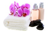 Set basalt stones, towel and orchid.