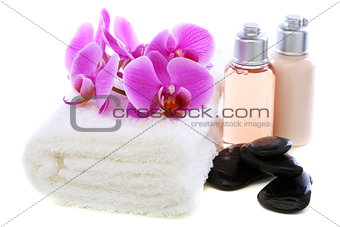 Set basalt stones, towel and orchid.