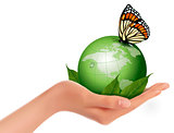 Green world with leaf and butterfly in woman hand. Vector illust