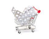 White pills packs in shopping cart