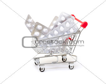 White pills packs in shopping cart