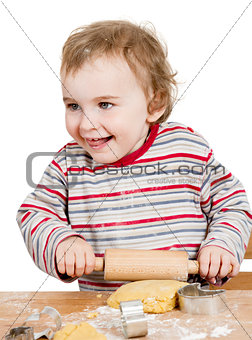 happy young child working with dough in white background