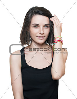 brunette in a black t-shirt straightens the hair on a white background. isolated