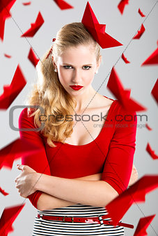 Woman with red paper boats