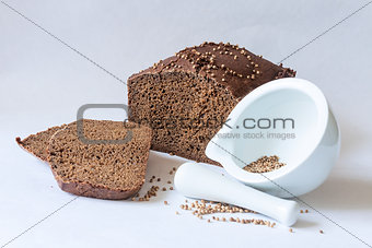 traditional Russian black bread with coriander seeds with mortar