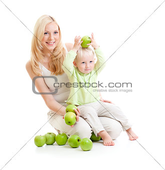 mother and son with green apples isolated