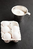 Eggs and cup of flour