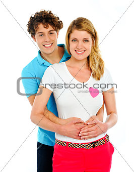 Smiling young couple standing together