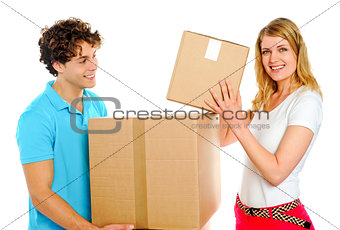 Couple arranging cardboard boxes