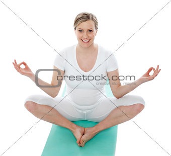 Attractive pregnant female doing exercise