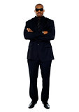 African corporate man standing with crossed arms