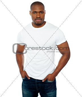 Trendy muscular guy posing in style