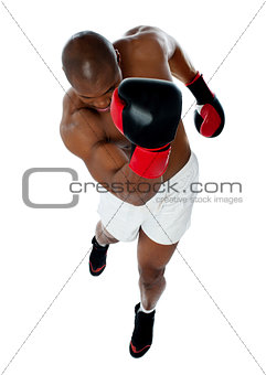 A black african athletic boxer with boxing gloves