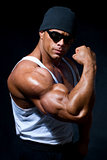 strong athletic man in dark glasses