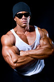 strong athletic man in dark glasses