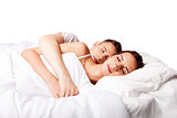 Couple happy asleep in bed