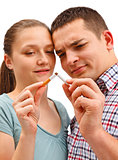 Couple breaking apart cigarette