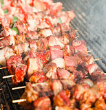 Meat pieces being fried; shish kebab