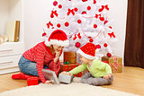 Children opening presents in Christmas