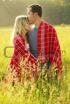 couple in love outdoors on a field